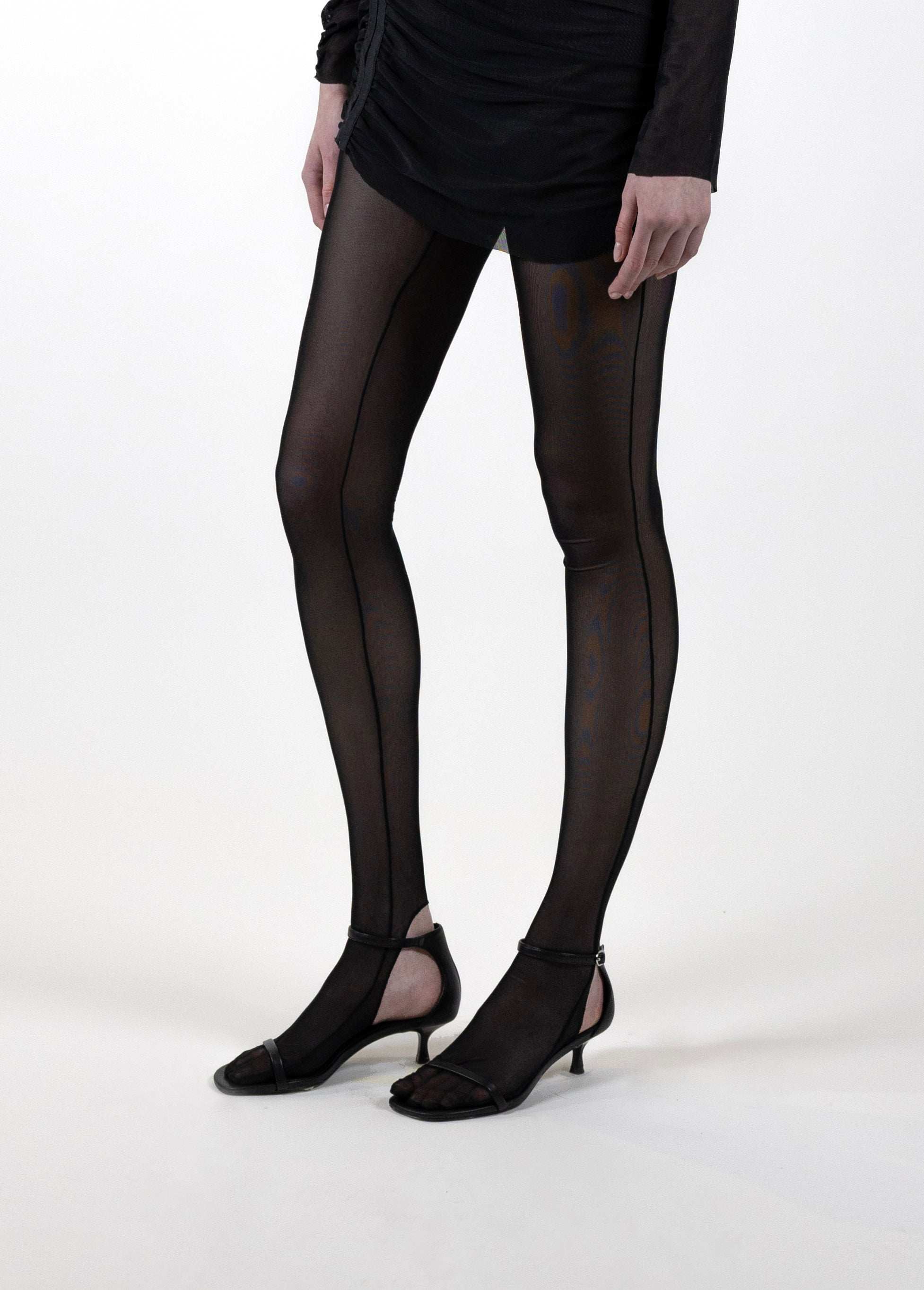 Black mesh Tabi leggings with split-toe design and breathable panels for a bold, avant-garde look.